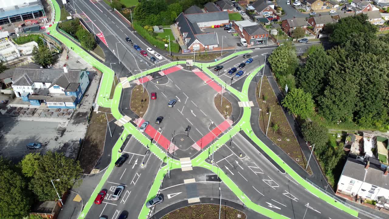 Aerial view St Helens CYCLOPS traffic optimisation sustainable junction intersection, England, Orbiting right
