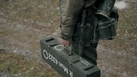 wwii german soldier carrying munitions box