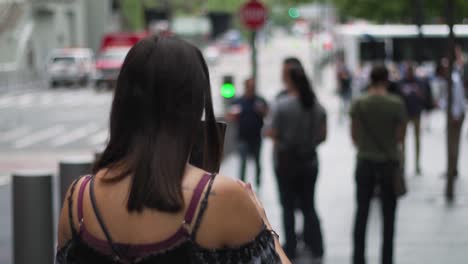 slow motion of young woman with smartphone on sidewalk in new york manhattan usa