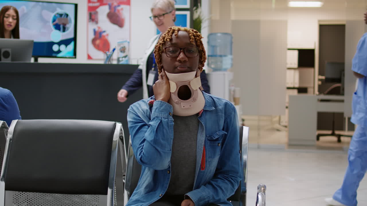 Woman with Neck Brace in Waiting Room