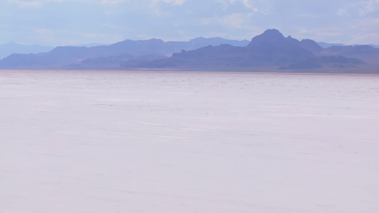 Vast Salt Flat Landscape with Distant Mountains