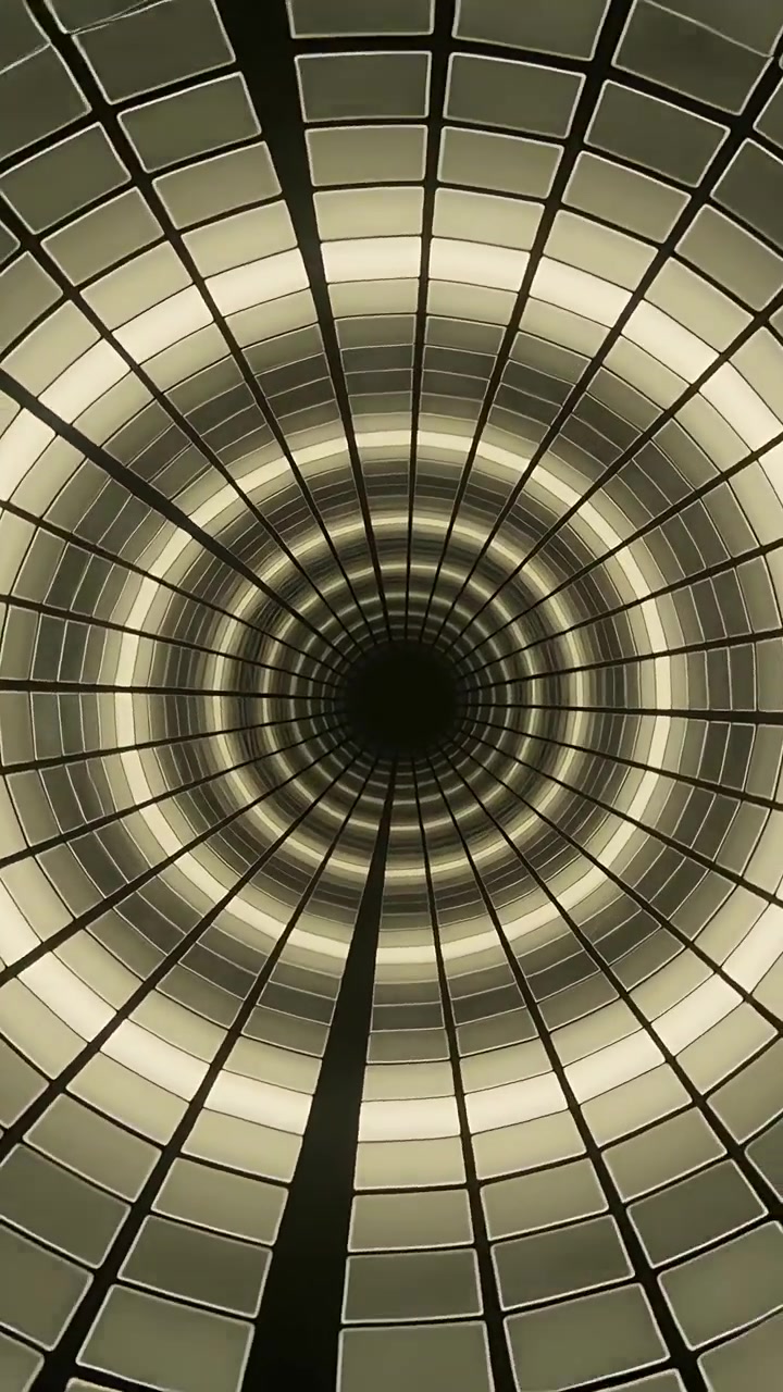 Vertical video: On play tiled tunnel rotating, pulsing and zooming in shaft, with center void, ribs