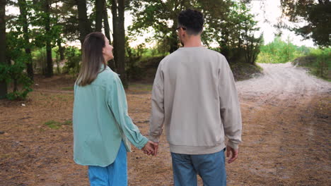 Couple-walking-in-the-forest