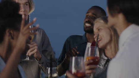 friends enjoying a rooftop party at sunset