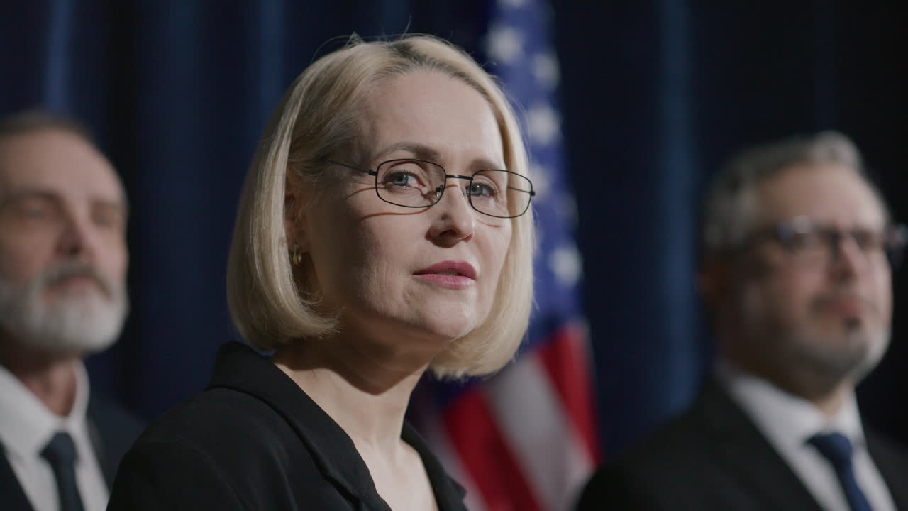 Portrait of Female Political Leader during Press Conference with Team