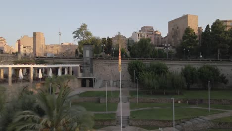 a captivating drone retreat from the morning cityscape of tarragona, spain, revealing the ancient coliseum, the city's cathedral, and the beautiful beach