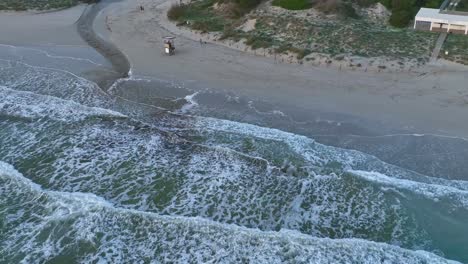 Water-slowly-entering-stream-along-Son-Bou-beach-in-Menorca,-Spain
