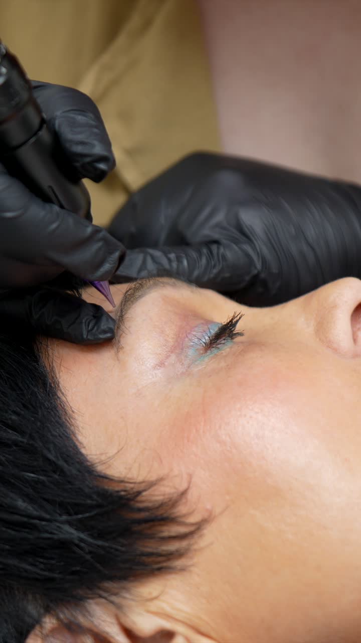 Close-up of Woman Receiving Eyebrow Microblading Procedure