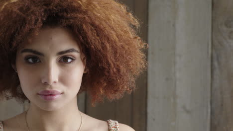 portrait-of-cute-young-woman-looking-serious-at-camera-teenage-girl-afro-hairstyle