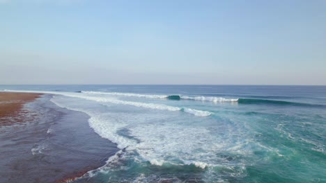 Crashing-Waves-at-Surf-Break-on-Uluwatu,-Bali-Coast---Aerial-with-Copy-Space