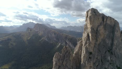 epic aerial flying through a mountain peak in the italian dolomites