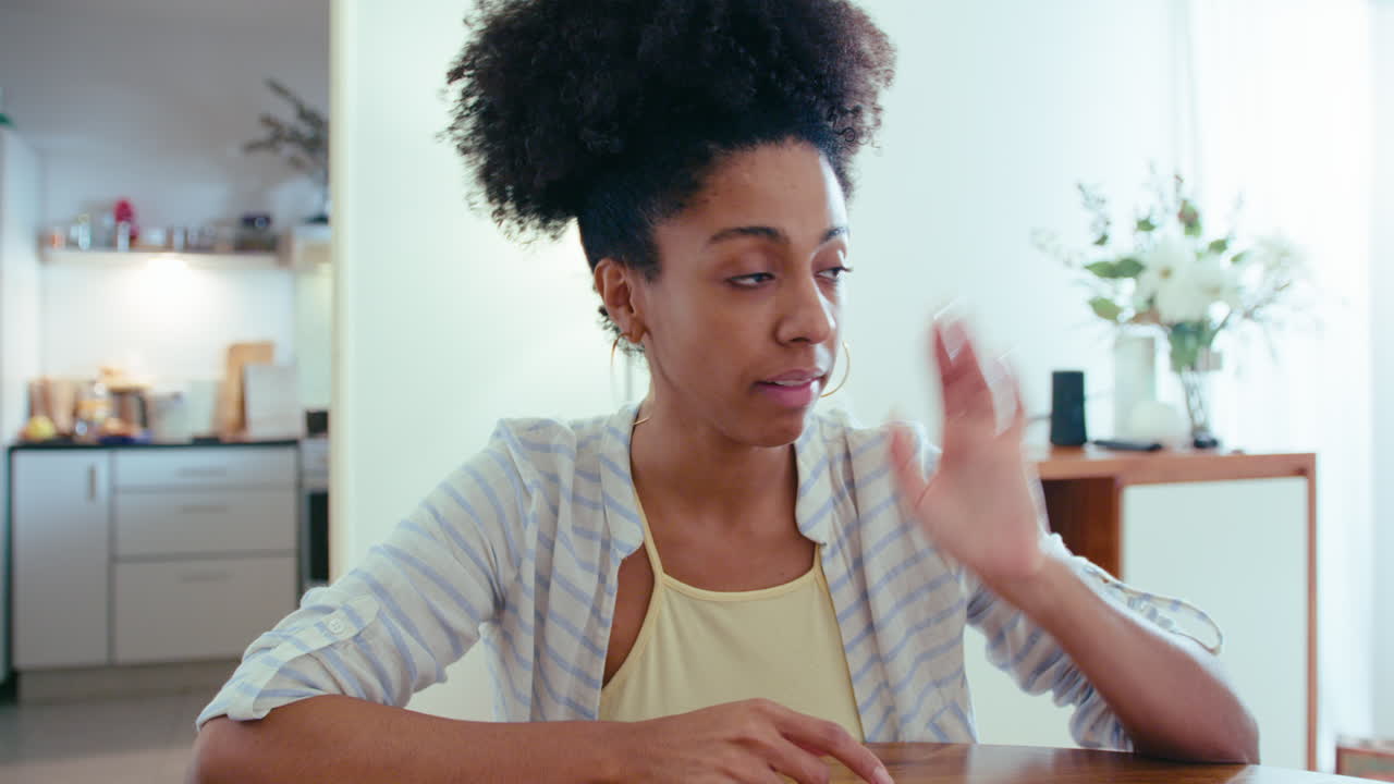 Beautiful Black Woman Talking on Web Call from Home