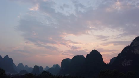 evening view footage of the lush and dense karst mountain landscape in yangshuo, guangxi province, china