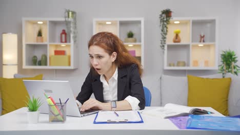 home office worker woman shocked by what he reads and sees.