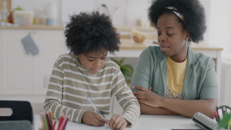 mother helping child with homework