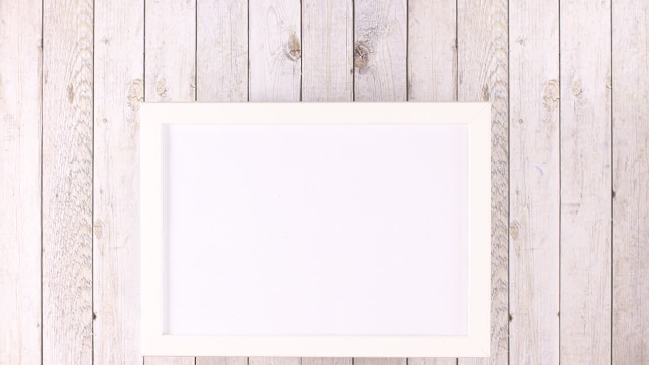 White frame with place for text and fruits and vegetables appear under frame. Stop motion