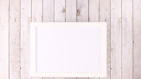 White frame with place for text and fruits and vegetables appear under frame. Stop motion