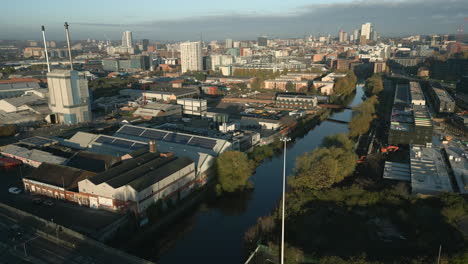 Establishing-Shot-of-Leeds-Inner-City-and-City-Centre-with-River-Aire-and-Glass-Manufacturing-Factory-at-Morning-Sunrise-West-Yorkshire-UK