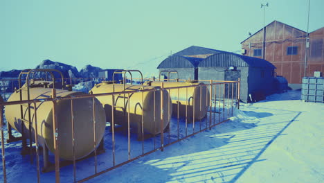 industrial storage tanks at an arctic research station in a remote location