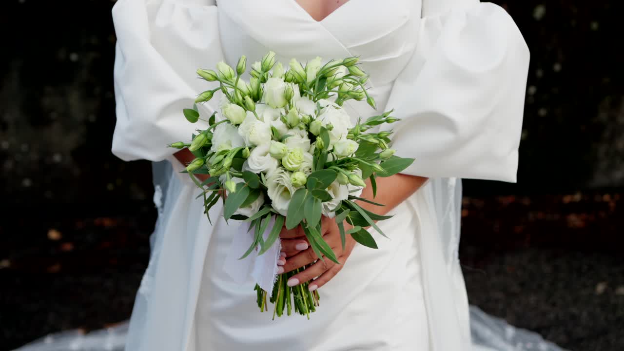 Bride Holding a Beautiful White Wedding Bouquet