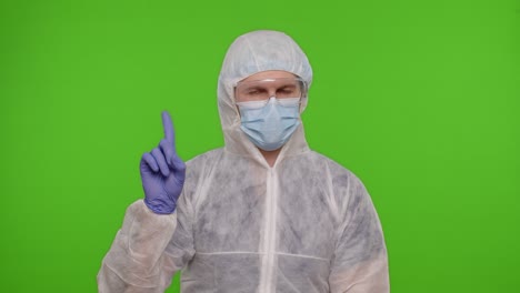 médico en traje de protección de ppe desaprueba mostrando advertencia rechazando peligroso no hay señal en la llave de croma