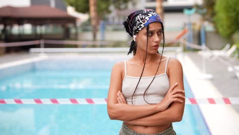 woman standing by a closed pool