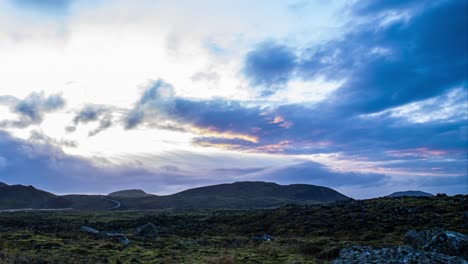 time lapse of dark clouds over volcanic landscape at the base of geldingadalir volcano, iceland - wide pan