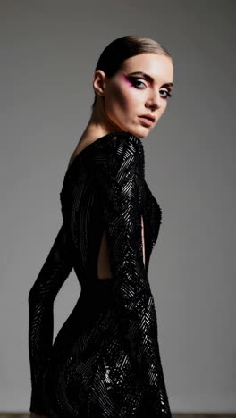 elegant woman in a beaded black dress