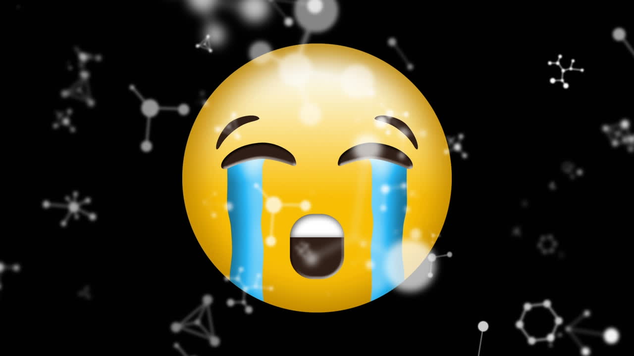 블랙 배경에 울고 있는 얼굴 이모지 위에 떠다니는 분자 구조의 디지털 애니메이션