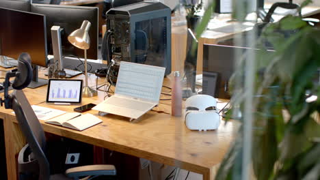 a modern business office desk setup with multiple screens and gadgets