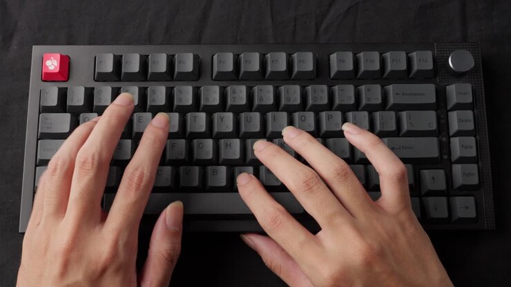 Hands typing rapidly on a mechanical keyboard, clear audible clicks, focus on fingers, indoor setting