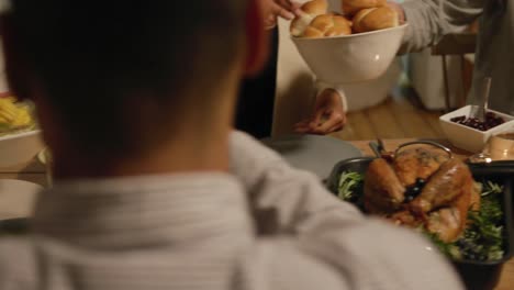 millennial adult friends celebrating thanksgiving together at home