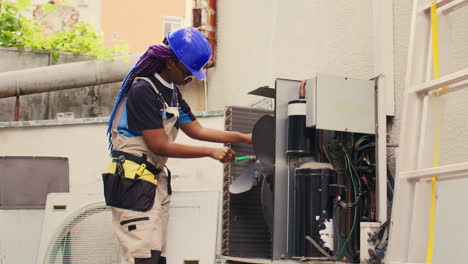 electrician doing condenser maintenance