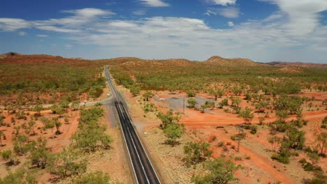 endless asphalt road through outback, northern territory in australia