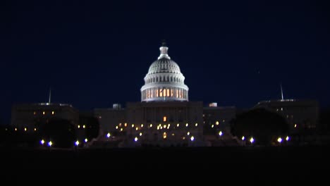 a long shot of the capitol building illuminated at night