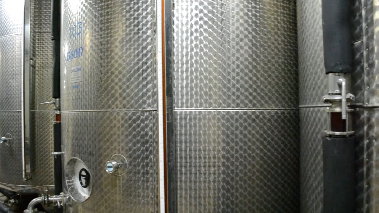 Wine Fermenting in huge vats in a wine