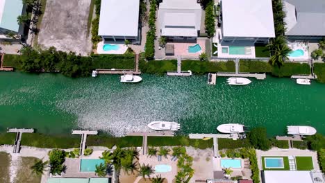 aerial-over-canal,-homes-and-boats-in-Marathon-Florida