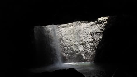 natural bridge waterfall at springbrook national park, part of the gondwana rainforests of australia world heritage area