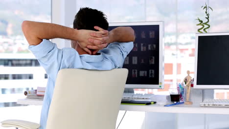 man relaxing in creative office