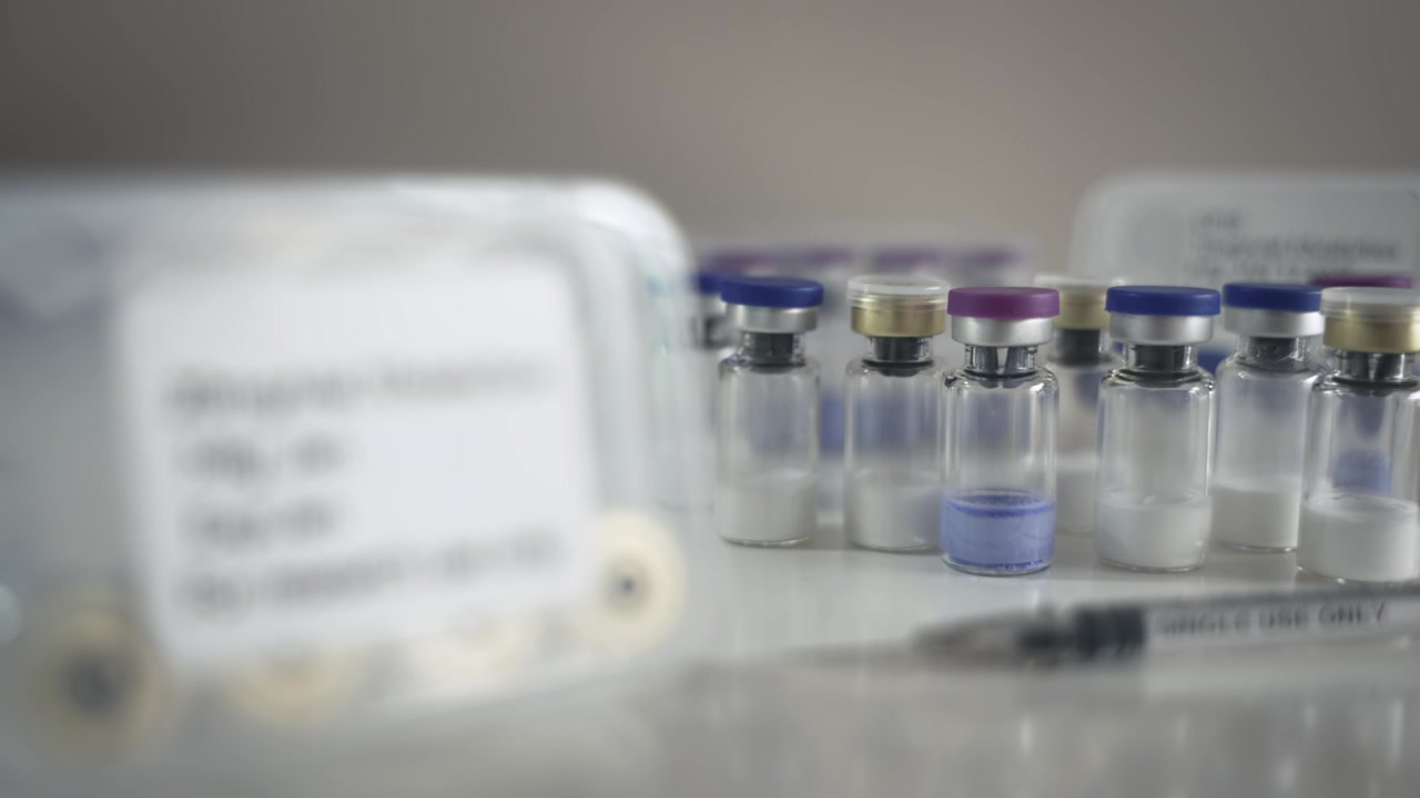 Rack Focus from Multiple Vials to Research Use Only Case and Syringe [Peptide Concept]