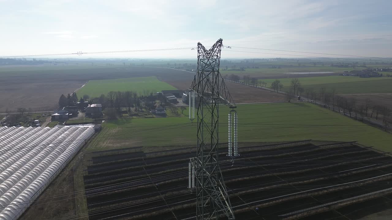 power pole electricity line aerial dolly back move solar farm panel foil