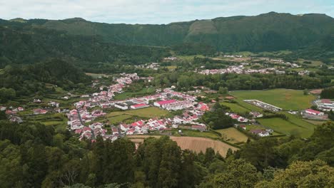 aerial view of a picturesque village nestled in a green valley