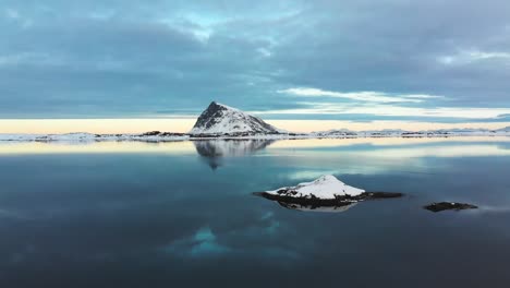 drone view of the mountain reflections in a lake