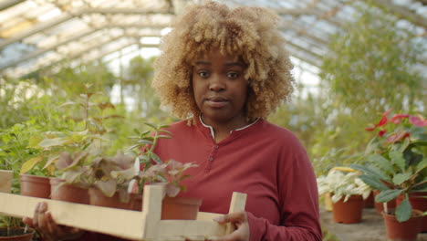portrait of female flower farmer in greenhouse