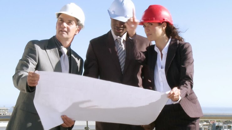 Three architects talking and exchanging their opinions