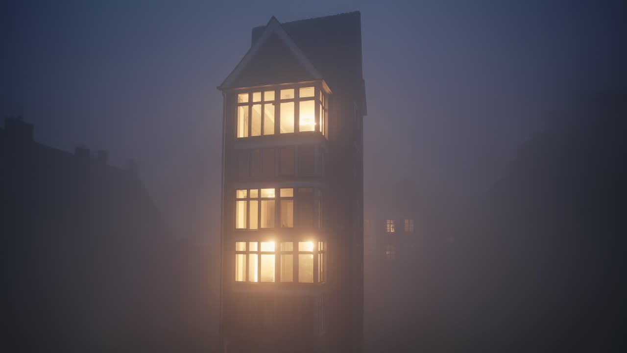 Warm lights emanating from windows of a building shrouded in dense fog during a serene night in Copenhagen, creating a mysterious and atmospheric urban landscape
