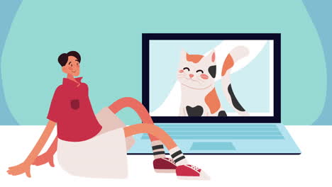 hombre sentado y viendo un video de gato en la computadora portátil