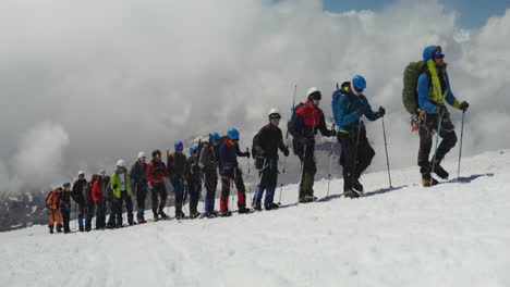 group of climbers on a mountain summit