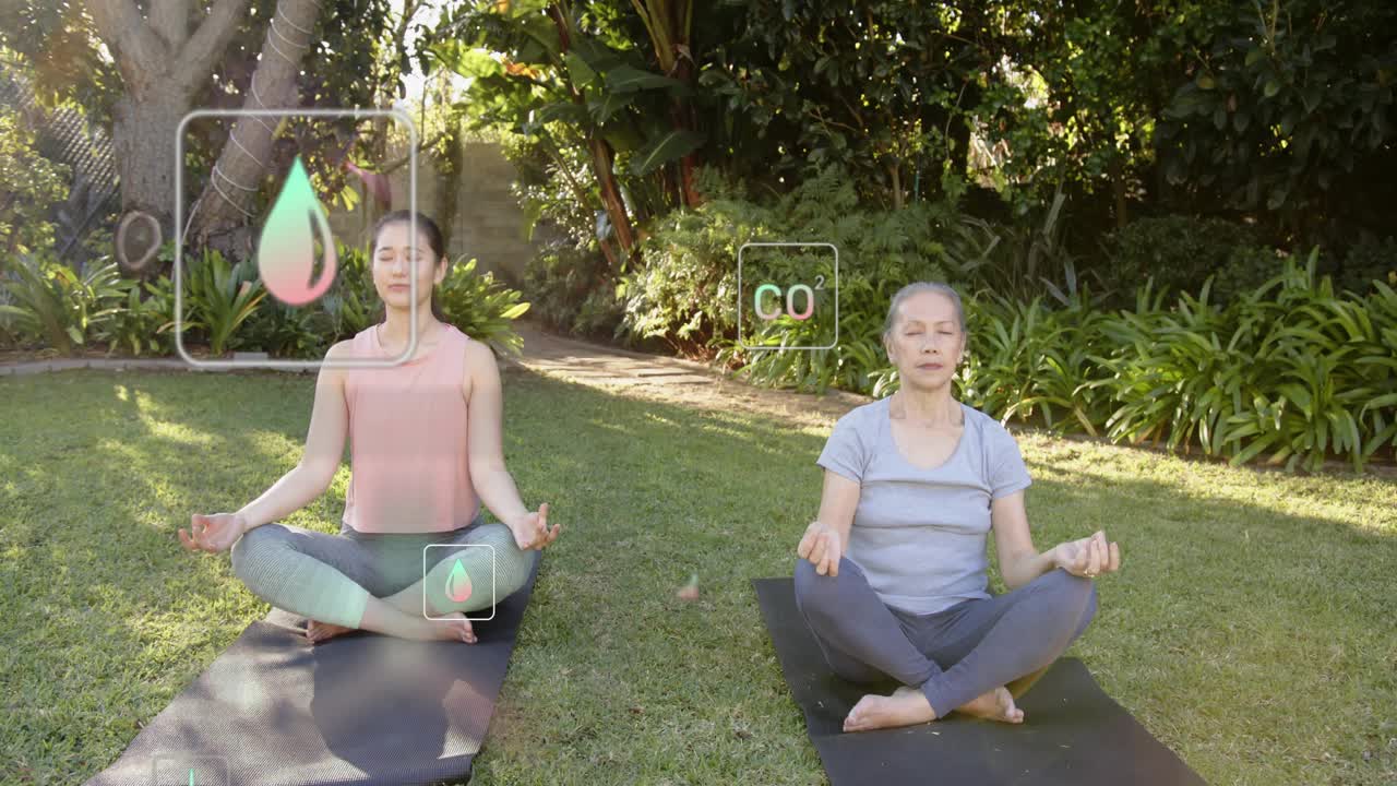 Senior woman releasing breath while mid-adult woman meditating, activating AR wellness icons