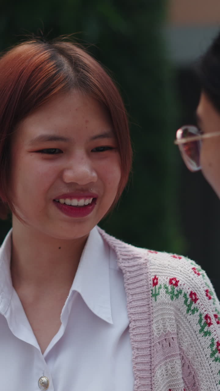 Two women looking at something together